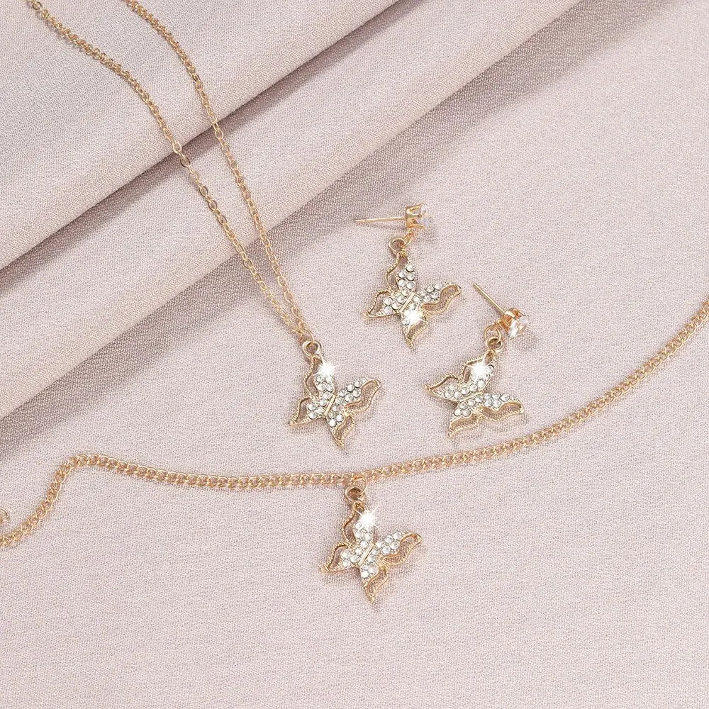 Ensemble bijoux trois pièces : boucles d'oreilles papillon, collier avec pendentif, bracelet,